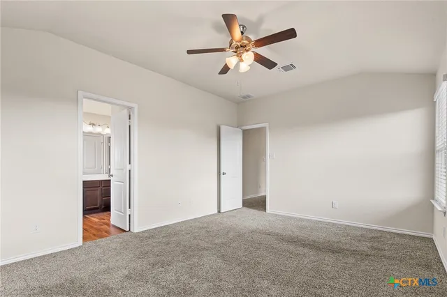 a view of a livingroom with a ceiling fan