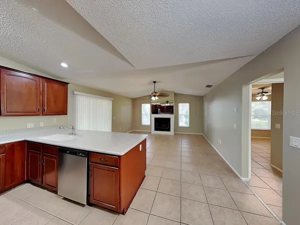 a kitchen with stainless steel appliances granite countertop a sink and cabinets