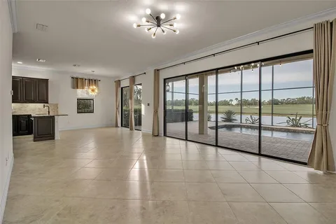 a kitchen with stainless steel appliances granite countertop a refrigerator a stove and a sink