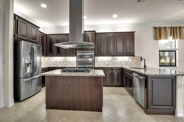 a bathroom with a granite countertop sink a mirror and shower