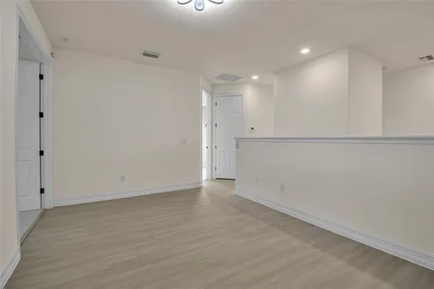 a bathroom with a granite countertop sink a toilet and bathtub