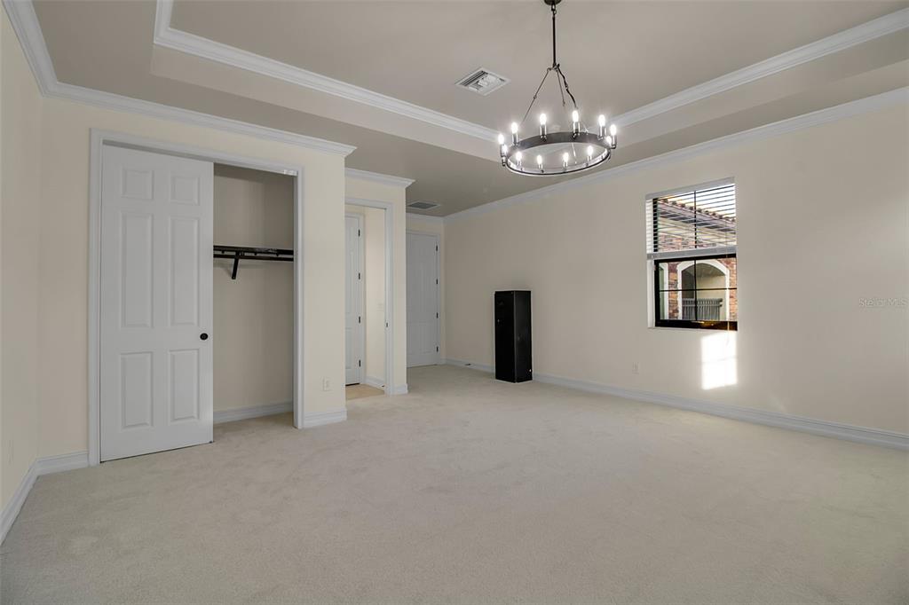 5609 Arnie Loop Lakewood Ranch, FL 34211 - Photo 36 of 64 a view of an empty room with window and wooden floor