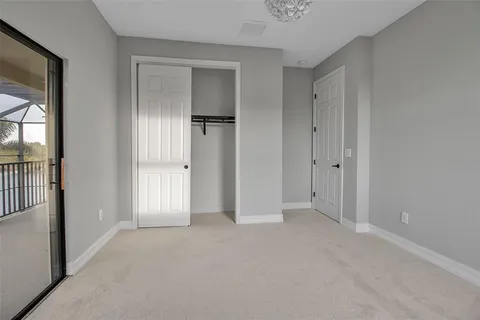 a view of a swimming pool with a lounge chair