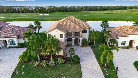 a aerial view of a house with a yard