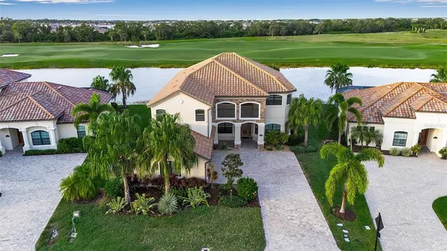 an empty room with floor to ceiling windows and pool table