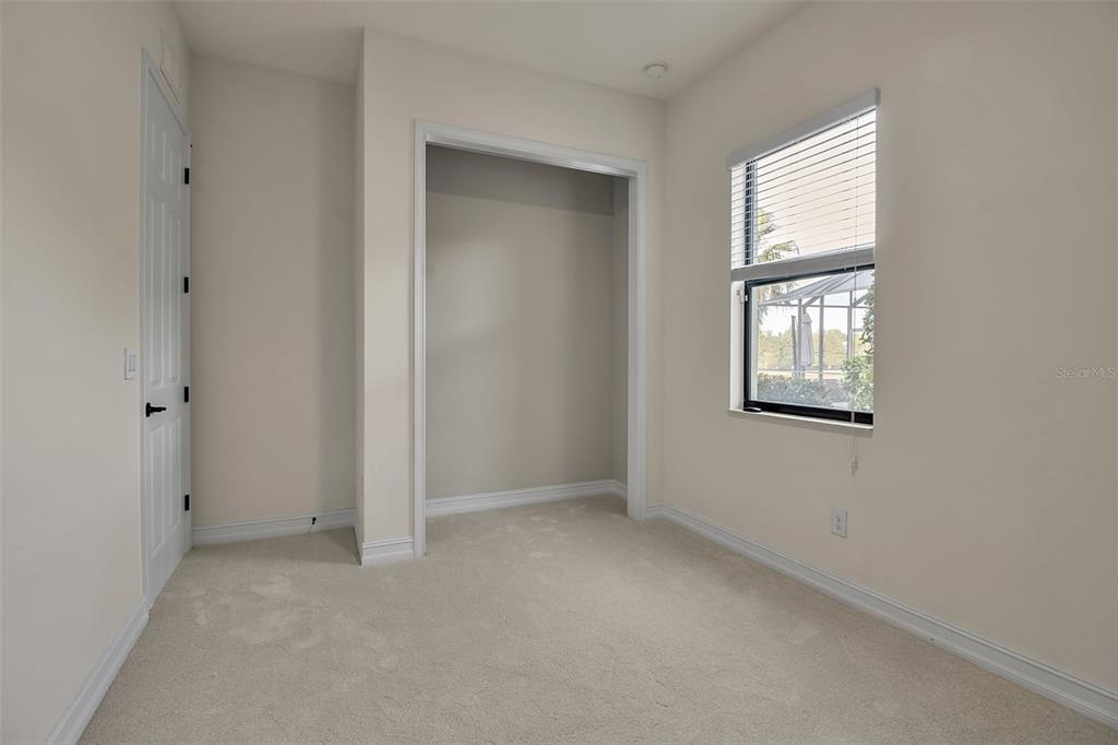 5609 Arnie Loop Lakewood Ranch, FL 34211 - Photo 48 of 64 an empty room with windows