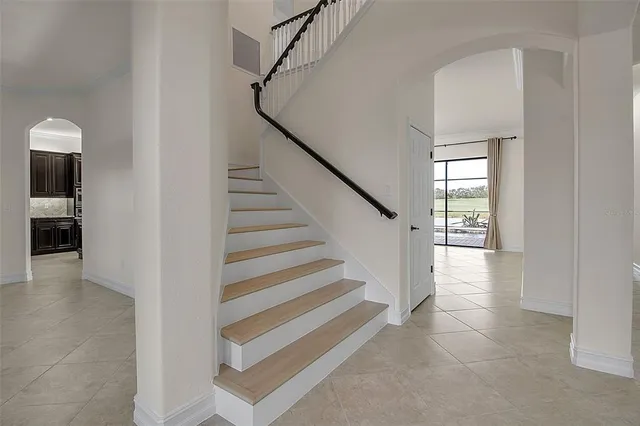 a kitchen with stainless steel appliances granite countertop a stove a refrigerator and a sink