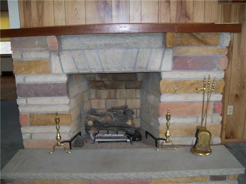 7961 Franklin Road Evans City, PA 16033 - Photo 12 of 19 Living Room. Stone fireplace in living room