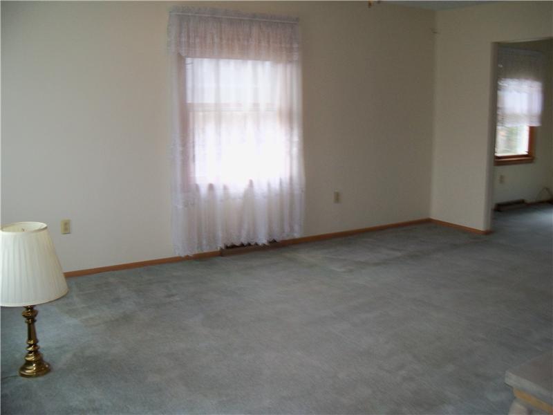 7961 Franklin Road Evans City, PA 16033 - Photo 9 of 19 Living Room. Another view of the living room, with plenty of windows for natural light