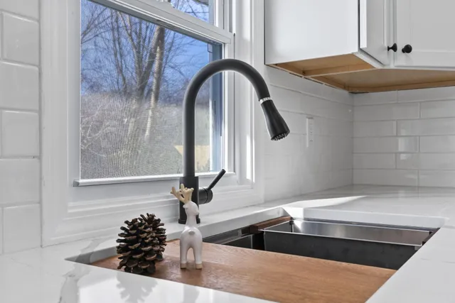 a close view of sink and mirror