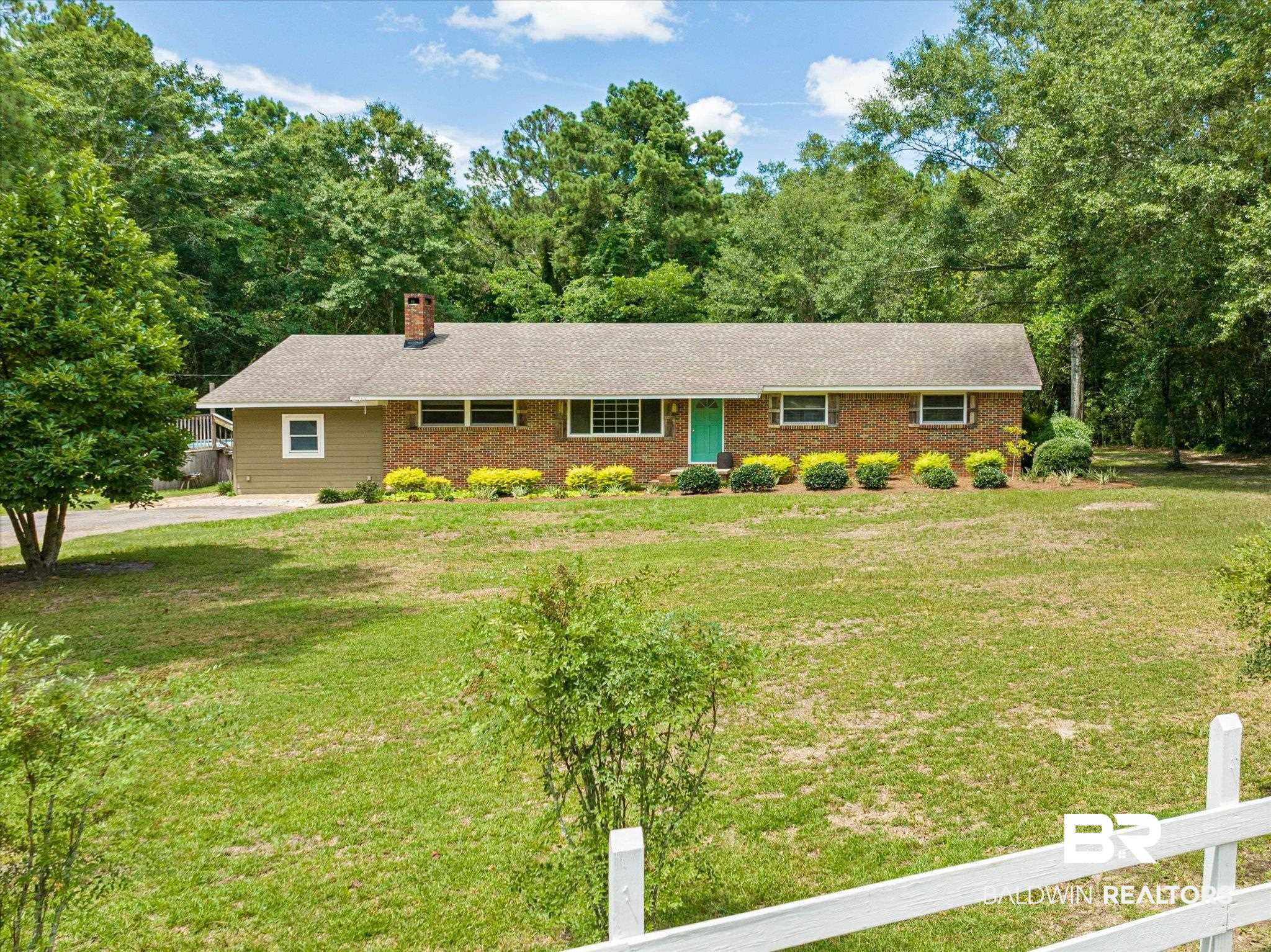 Ranch-style home with a front yard