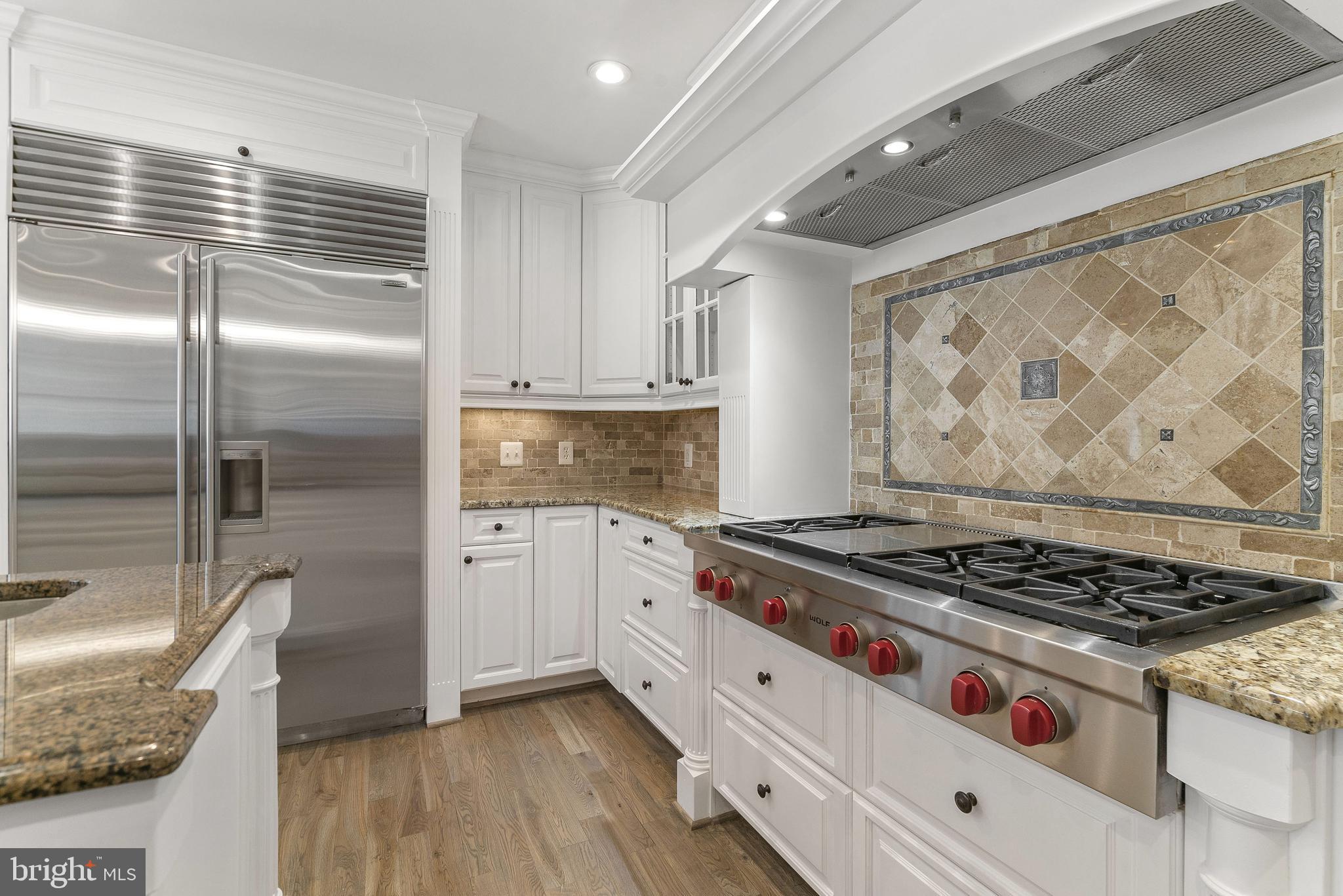 7323 Arrowood Road Bethesda, MD 20817 - Photo 15 of 64 Wolf 6 burner gas cooktop with griddle
