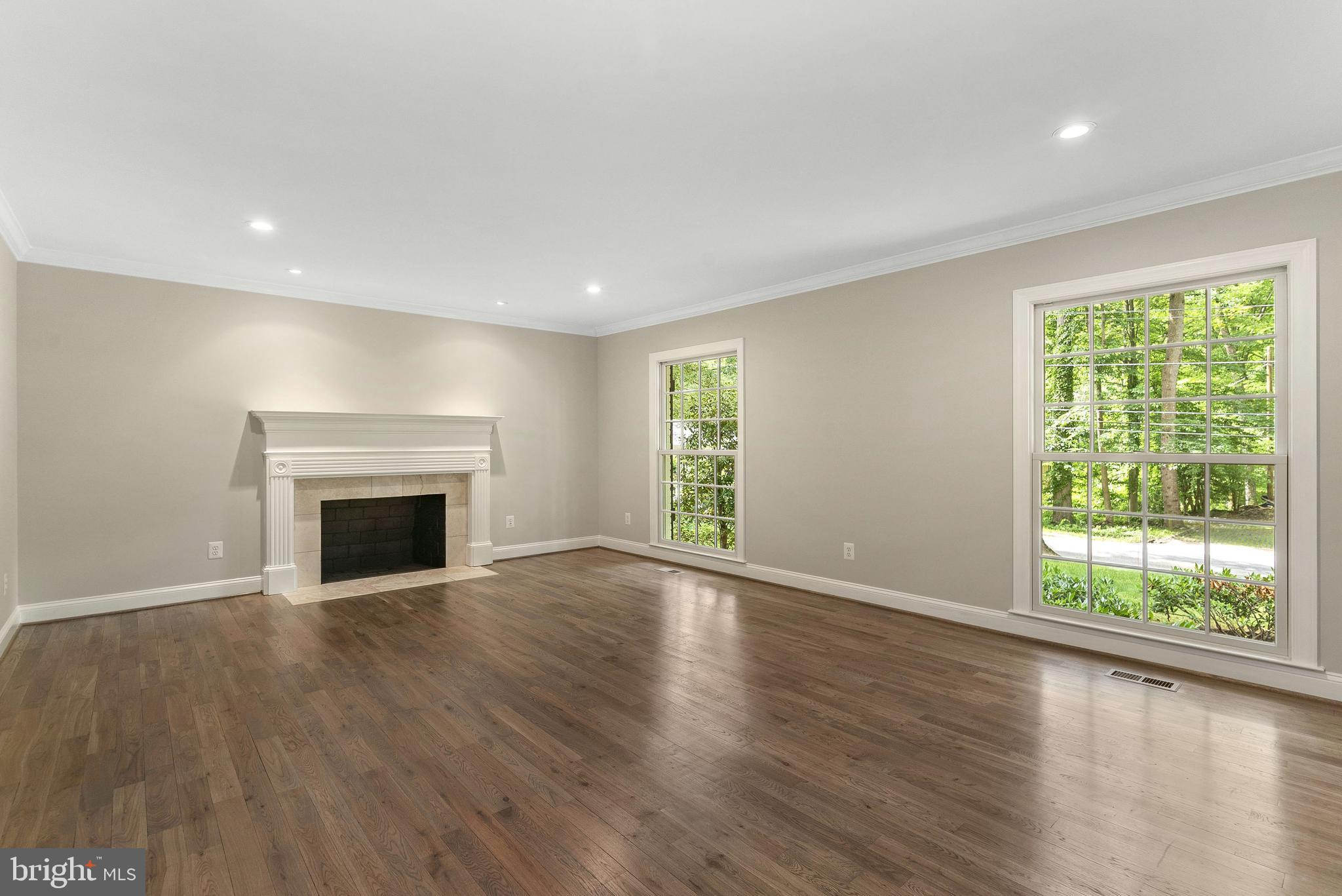 7323 Arrowood Road Bethesda, MD 20817 - Photo 7 of 64 Living room with wood burning fireplace