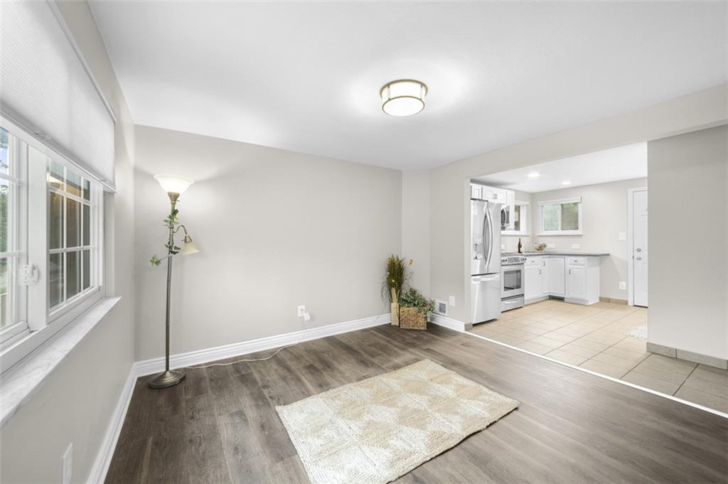 359 Hochberg Road Monroeville, PA 15146 - Photo 12 of 30 a view of a livingroom with wooden floor and a kitchen