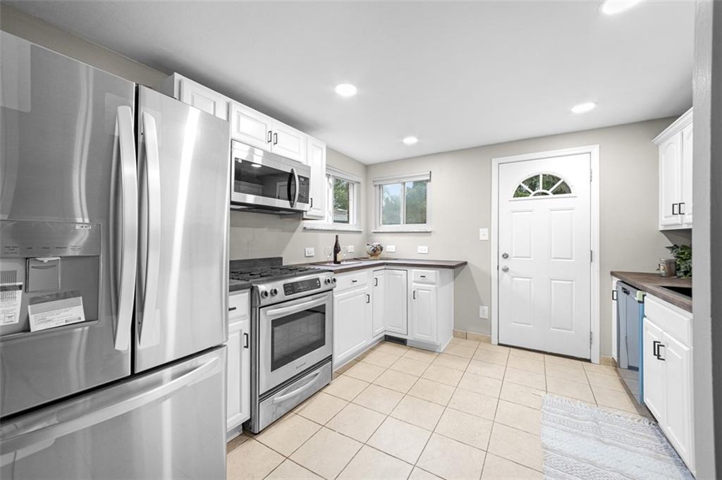 359 Hochberg Road Monroeville, PA 15146 - Photo 15 of 30 a kitchen with granite countertop a refrigerator stove and sink