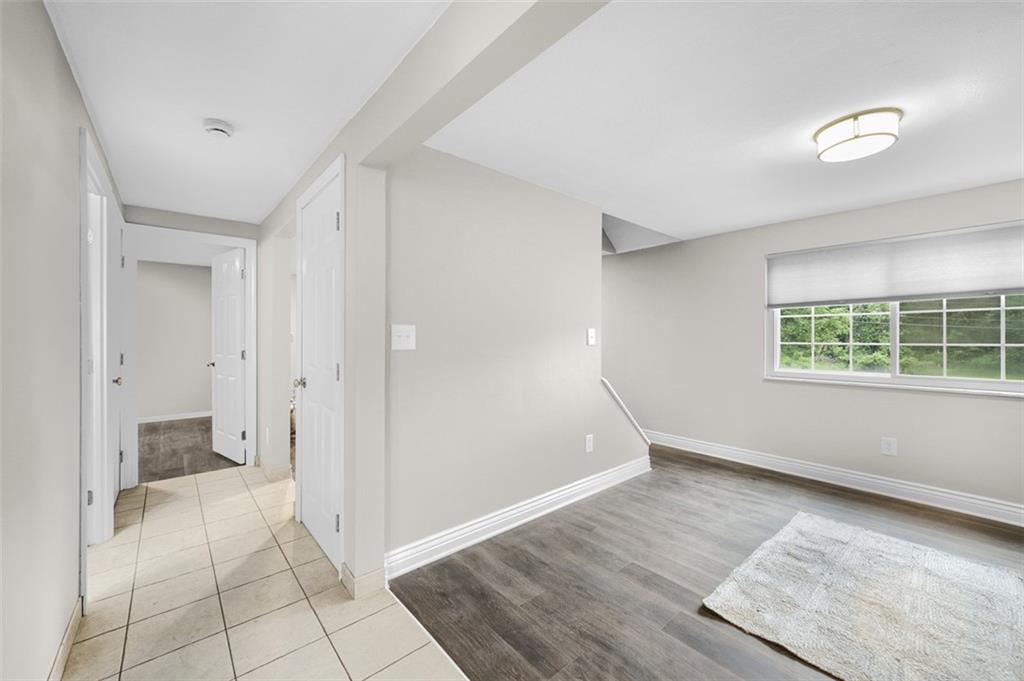 359 Hochberg Road Monroeville, PA 15146 - Photo 20 of 30 wooden floor in an empty room with a window