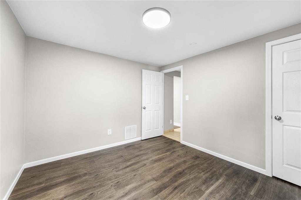 359 Hochberg Road Monroeville, PA 15146 - Photo 23 of 30 an empty room with wooden floor and windows