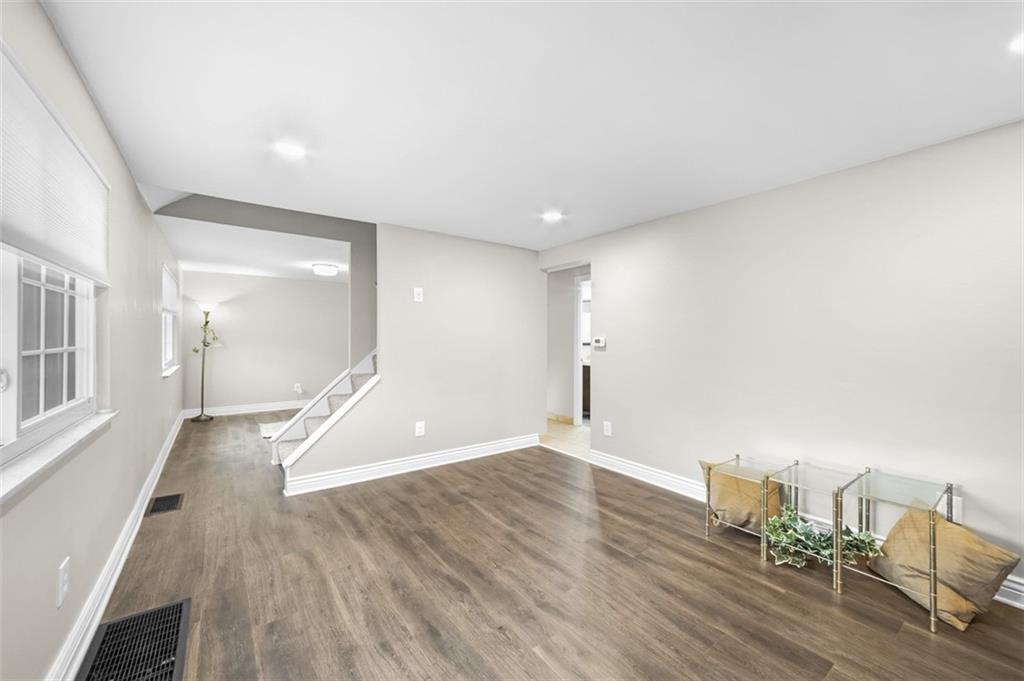 359 Hochberg Road Monroeville, PA 15146 - Photo 9 of 30 an empty room with wooden floor and windows