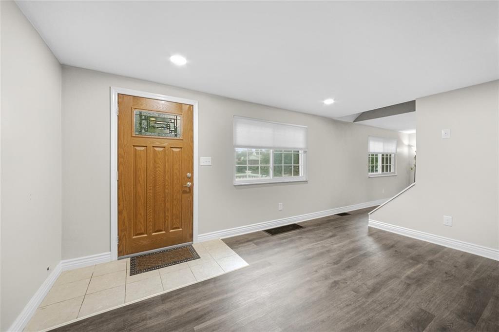 359 Hochberg Road Monroeville, PA 15146 - Photo 10 of 30 an empty room with wooden floor and windows