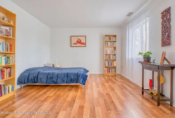 a bedroom with a bed and a table in it