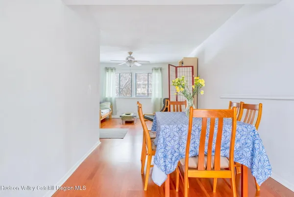 a dining room with furniture and a white floor