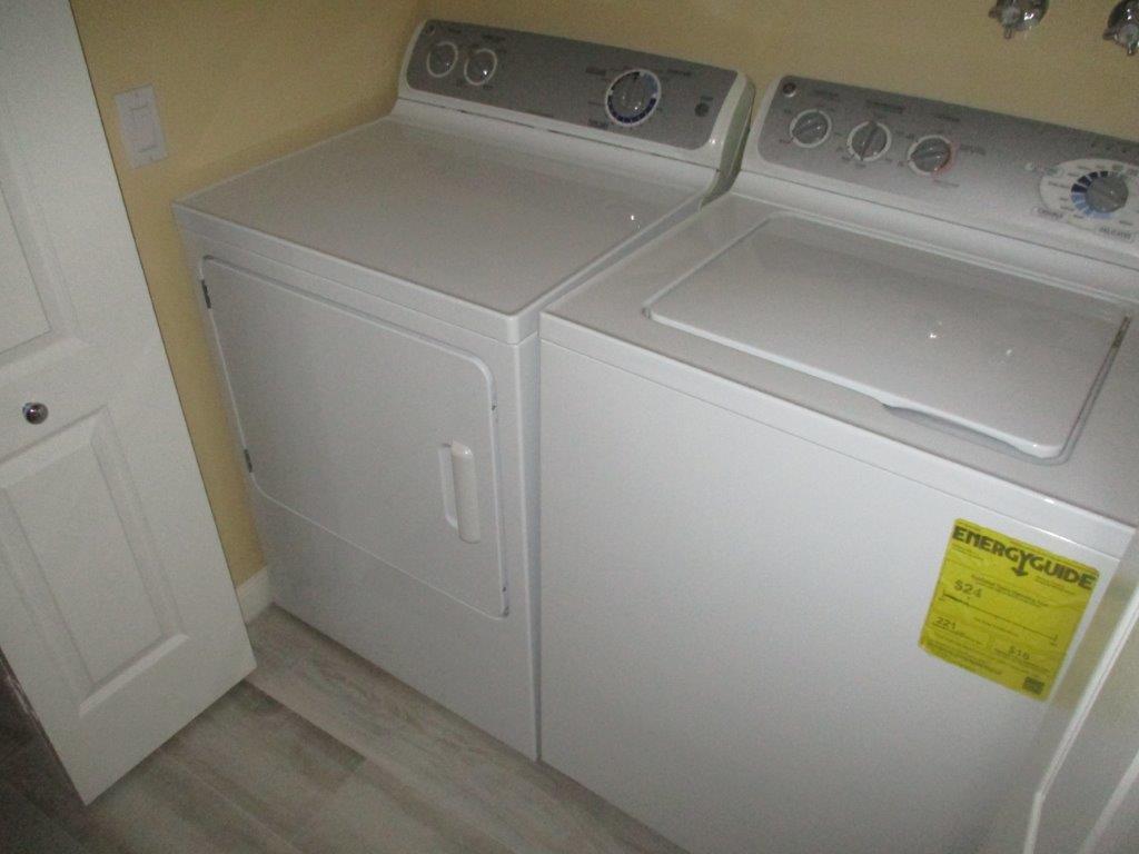 57 Laurel Oaks Circle Tequesta, FL 33469 - Photo 12 of 18 a utility room with dryer and washer