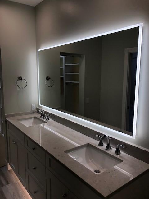 57 Laurel Oaks Circle Tequesta, FL 33469 - Photo 14 of 18 a bathroom with a sink and mirror