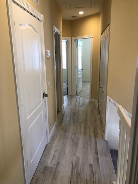 57 Laurel Oaks Circle Tequesta, FL 33469 - Photo 16 of 18 a view of a hallway with wooden floor and staircase