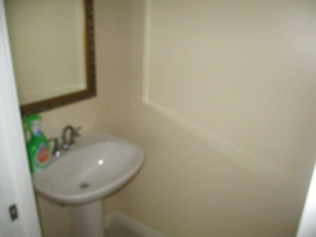 57 Laurel Oaks Circle Tequesta, FL 33469 - Photo 6 of 18 a bathroom with a sink and mirror