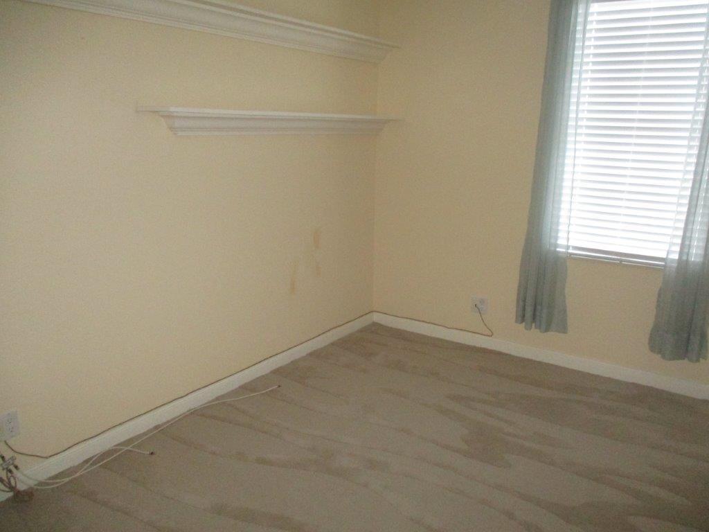 57 Laurel Oaks Circle Tequesta, FL 33469 - Photo 8 of 18 a room that has a window in it