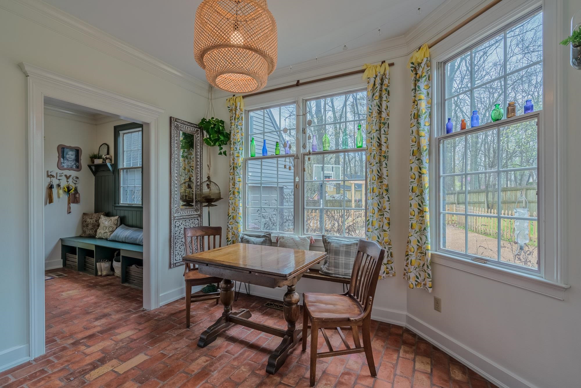 810 West Tree Cove Collierville, TN 38017 - Photo 13 of 25 a view of a dining room with furniture window and wooden floor