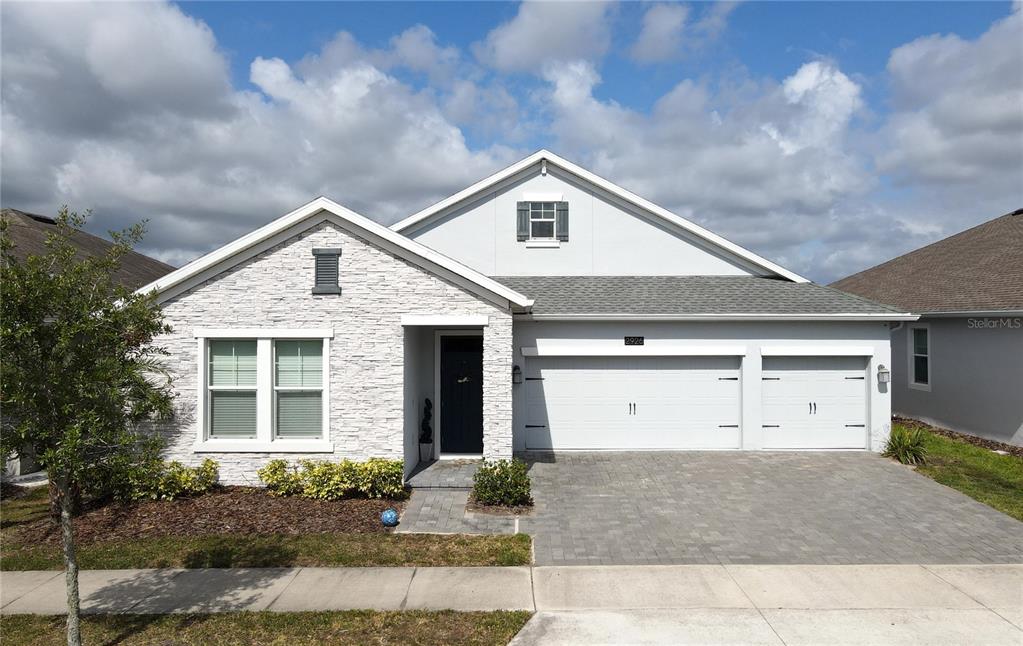 a front view of a house with garage