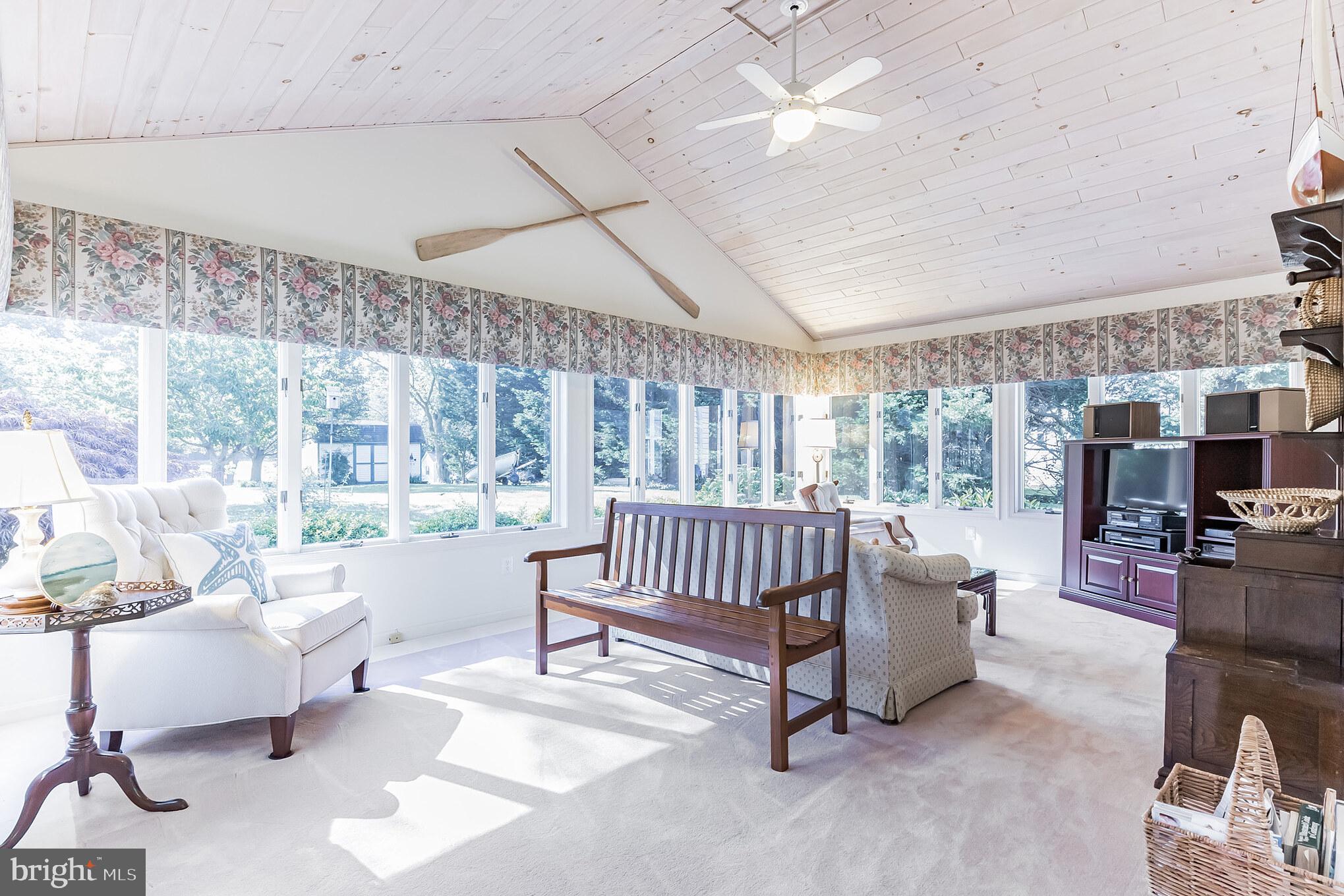 48591 Bean Road Ridge, MD 20680 - Photo 13 of 31 great room with vaulted ceiling and tinted windows