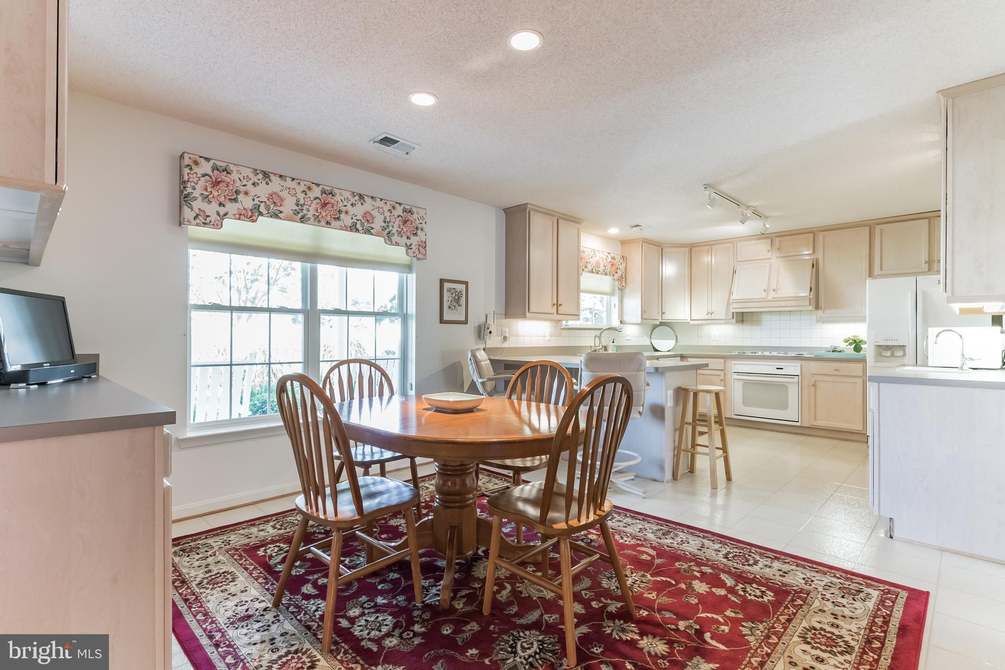 48591 Bean Road Ridge, MD 20680 - Photo 6 of 31 bright and airy kitchen w/ excellent storage