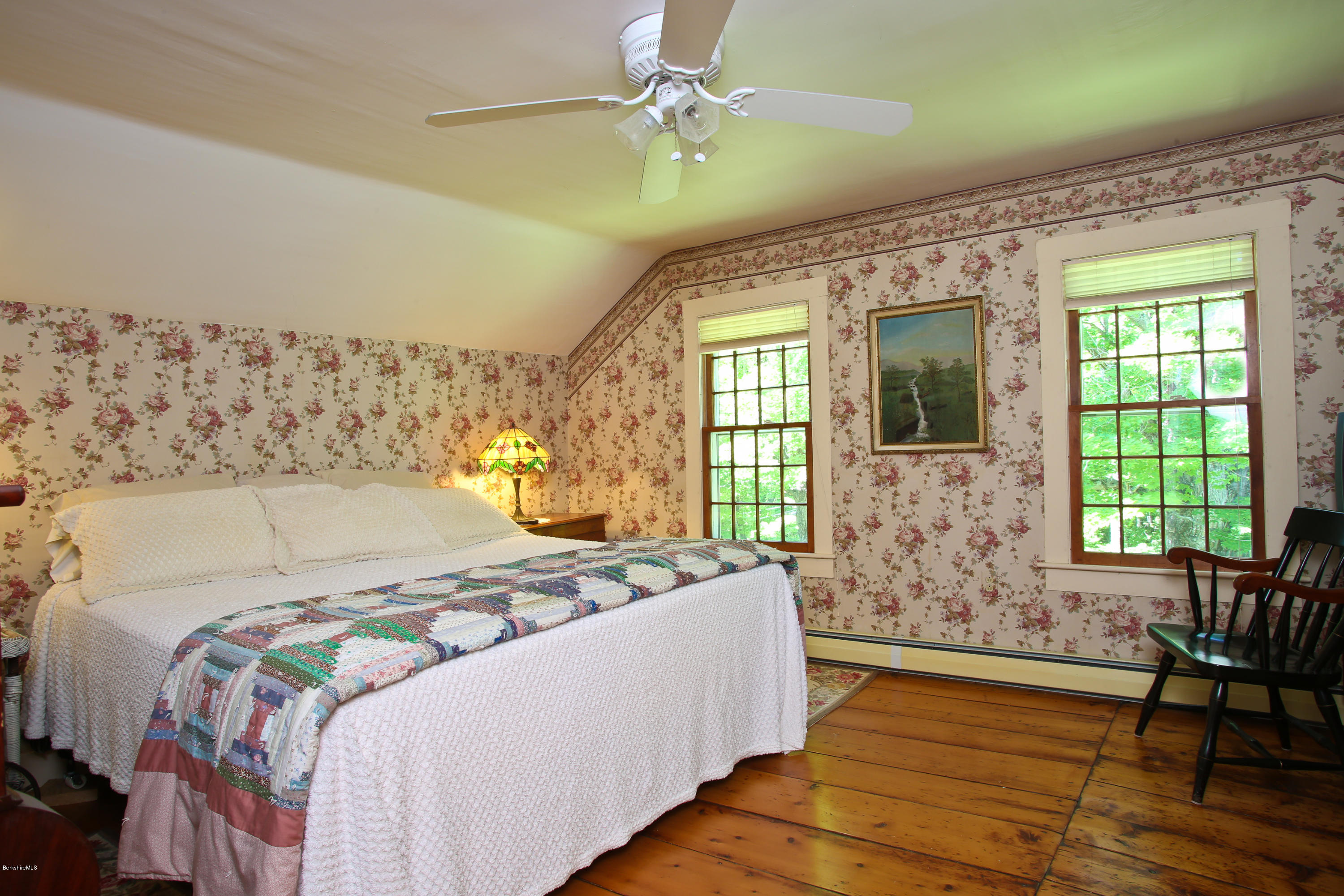 137 Leshure Road Rowe, MA 01367 - Photo 21 of 56 a bed sitting in a bedroom next to a window