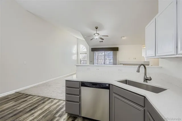 a kitchen with a sink cabinets and appliances