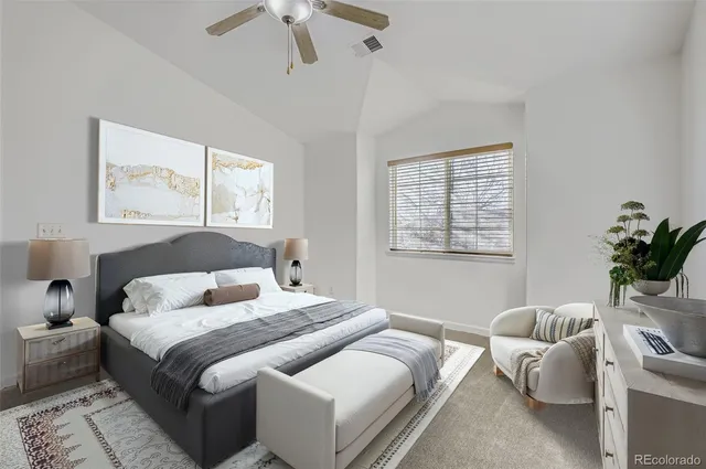 a bedroom with furniture and a window