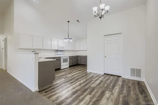 a view of kitchen with granite countertop cabinets a sink and dishwasher