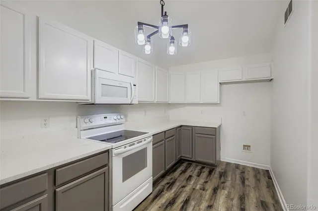 a kitchen with a sink cabinets and window