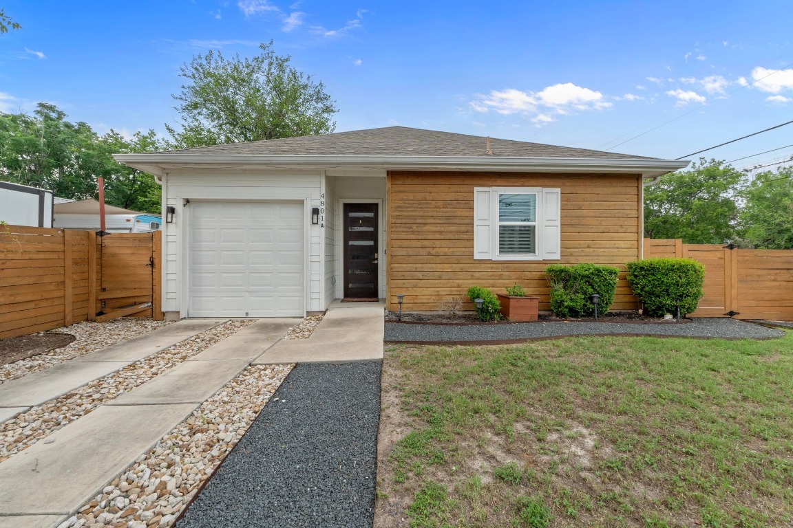 4801 Louis Avenue, Unit 1 Austin, TX 78721 - Photo 1 of 26 View of front facade with a gate and driveway