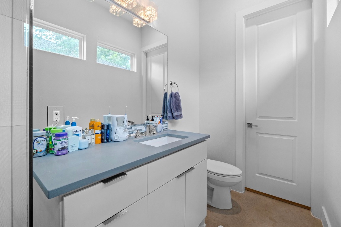 4801 Louis Avenue, Unit 1 Austin, TX 78721 - Photo 18 of 26 Half bath featuring vanity and toilet