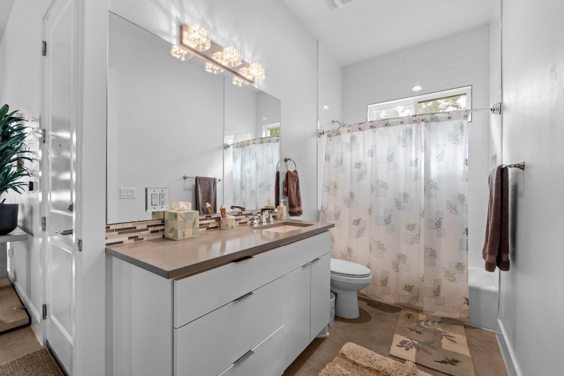 4801 Louis Avenue, Unit 1 Austin, TX 78721 - Photo 21 of 26 Full bath with vanity and shower / bath combo with shower curtain