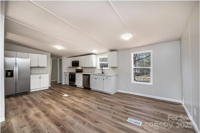 a view of a kitchen with a sink cabinets and window