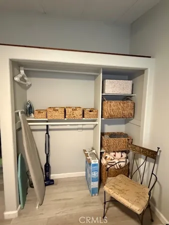 a bedroom with a bed and a chair