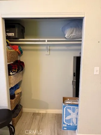 a bedroom with a bed and chair