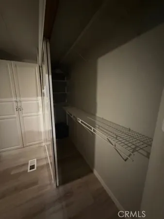 a view of bathroom with a toilet sink and mirror
