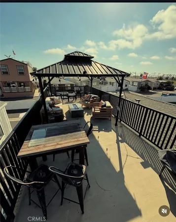 a terrace with a table and chairs