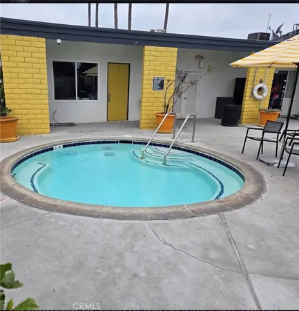 a view of swimming pool with seating space