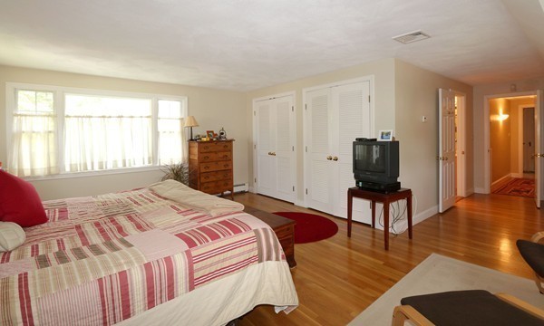 43 Boulder Brook Road Wellesley, MA 02481 - Photo 13 of 23 a bedroom with a bed and wooden floor