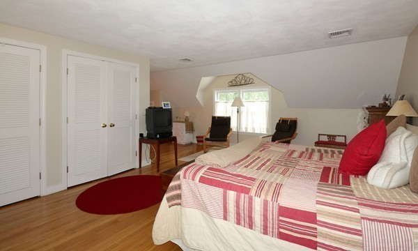 43 Boulder Brook Road Wellesley, MA 02481 - Photo 14 of 23 a bedroom with a bed and a chandelier
